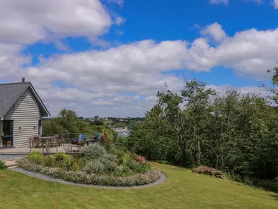 a house with a garden in the yard at Wood Meadow in Helston