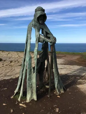 a statue of a person with a telescope at Trewethen Cottage Barn 2 near Port Isaac in Port Isaac