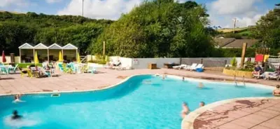 a large swimming pool with people in the water at 58 Newquay View, Newquay Bay Resort in Porth