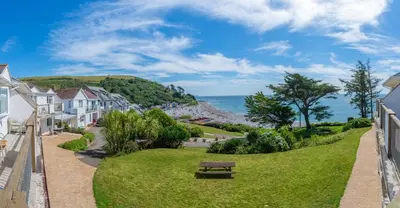 a view of the ocean from the balcony of a house at Beach View - Mount Brioni in Downderry
