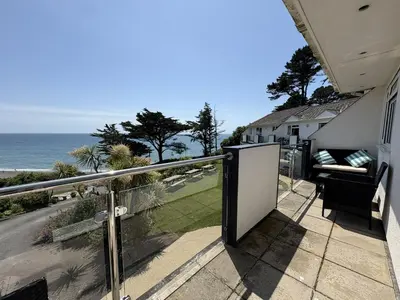 a balcony with a view of the ocean at View of the Sea - Mount Brioni in Downderry