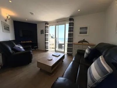 a living room with a couch and a coffee table at View of the Sea - Mount Brioni in Downderry