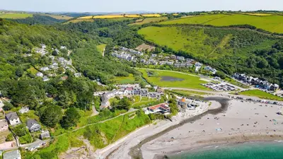 an aerial view of a town with a beach at Breakers - Mount Brioni in Downderry