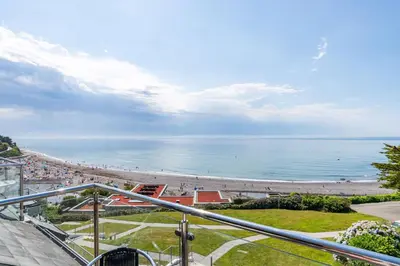 a view of a beach with people on it at Breakers - Mount Brioni in Downderry