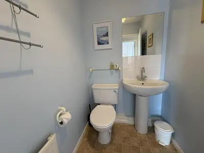 a bathroom with a toilet and a sink at Sunrise Bay - Mount Brioni in Downderry