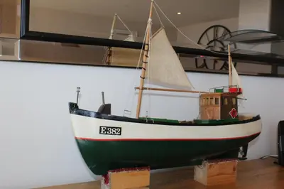 a model of a boat on display on a wall at Sunset Surf - Mount Brioni in Downderry