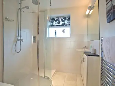 a bathroom with a shower and a sink at Sunset Surf - Mount Brioni in Downderry