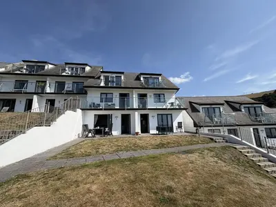 an exterior view of a large white house at Mi Casa Su Casa - Mount Brioni in Downderry