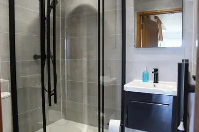 a bathroom with a shower and a sink at Seascape - Mount Brioni in Downderry