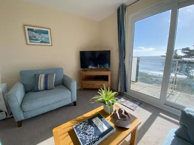 a living room with a view of the ocean at Tide Watch - Mount Brioni in Downderry