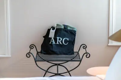 a black bag sitting on a chair in a room at Finest Retreats - ARC Padstow in Little Petherick