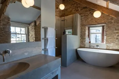 a large bathroom with a large tub and a sink at Finest Retreats - ARC Padstow in Little Petherick