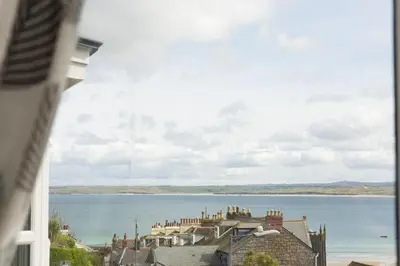 a view of a large body of water from a window at Windsor Lookout in St Ives