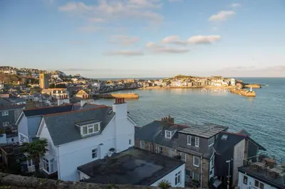 a view of a city and the water with buildings at Windsor Lookout in St Ives