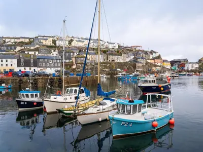 a group of boats are docked in a harbor at Finest Retreats - Old Harbour Cottage in Mevagissey