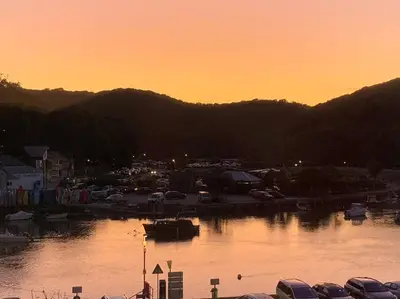 a group of boats parked in a marina at sunset at Superb House in Looe, Near Beach and Bars with Great Views and free access to a nearby Indoor Swimming Pool in Looe