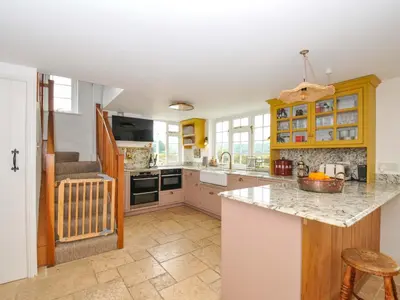 a kitchen with a counter top and a sink at Island House in Fowey