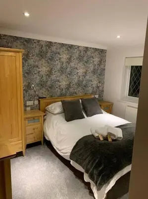 a bedroom with a bed and a wall at 44 Raleigh Close@Padstow in Padstow