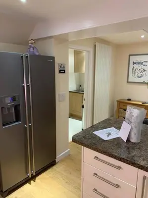 a kitchen with a stainless steel refrigerator at 44 Raleigh Close@Padstow in Padstow