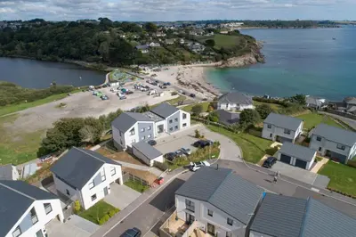 an aerial view of a beach and houses at Swanpool View - Walk to Beach - Free WiFi & Parking - Sea & Lake Views in Falmouth