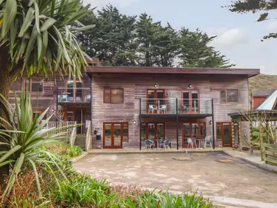 an exterior view of a house with a patio at Tolcarne in Truro