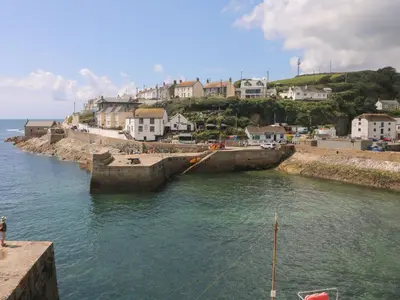 a view of a body of water with buildings and houses at The Reading Room in Falmouth