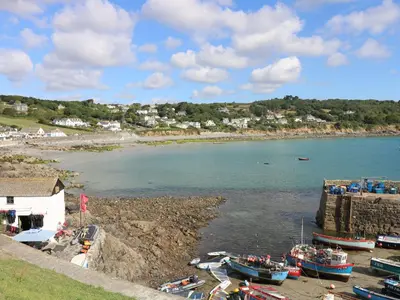 a group of boats are docked in a harbor at The Reading Room in Falmouth
