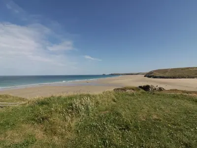 a view of a beach with the ocean in the background at Perran Pearl B in Perranporth