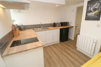 a kitchen with a sink and a counter top at Perran Pearl B in Perranporth