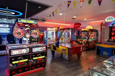 a room with many arcade games and arcade machines at ELITE BLUE LUXURY 3 BEDROOM LODGE NEWQUAY, CORNWALL in Newquay
