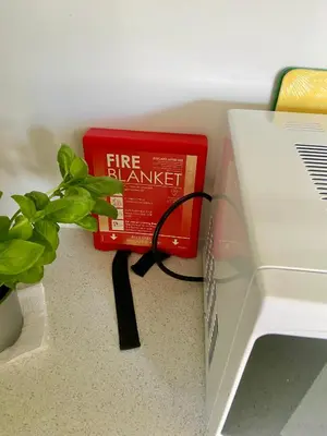 a fire exchange box sitting next to a laptop at Romantic log-burner Cornish Cottage private garden dogs welcome in Truro
