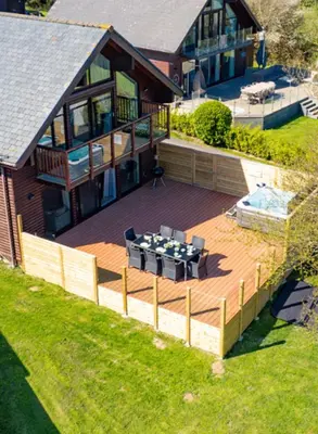 an overhead view of a deck in front of a house at Puffin Hot tub Lodge, 4 bedrooms Resort, Pool,Gym,Bar in Padstow
