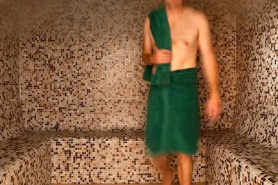 a man in a green dress standing on a wall at Retallack Resort 4 bedroom lodge - Hot Tub for hire on request -Pool & Spa in Padstow