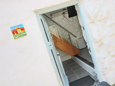 an open door to a shower in a bathroom at The Old Stable in Helston