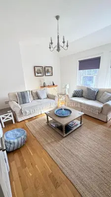 a living room with two couches and a coffee table at Harbour Retreat Padstow - Entire Apartment in the beautiful old town of Padstow Harbour in Padstow