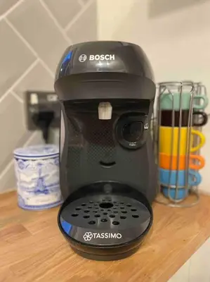 a black coffee maker sitting on a wooden table at No3 Gweek in Gweek
