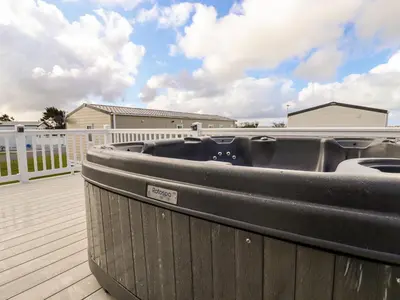 a boat sitting on top of a deck at 109 Bude in Newquay