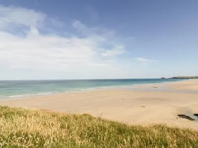 a beach with the ocean in the background at 109 Bude in Newquay