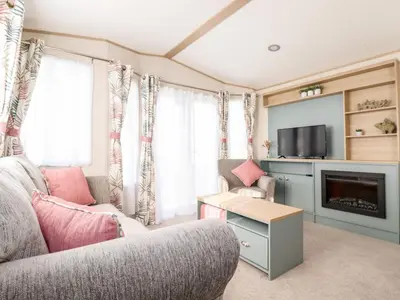 a living room with a couch and a tv at 109 Bude in Newquay