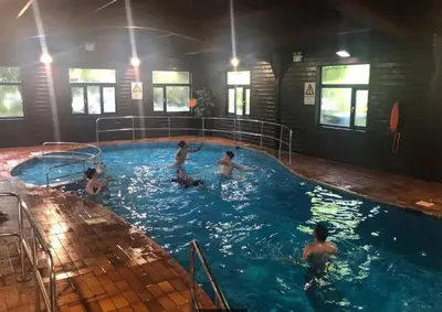 a group of children playing in a swimming pool at Tudor Cottage Hayle - a Family & Dog Favourite in Hayle