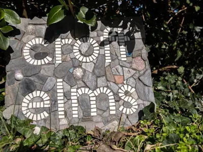 a stone sign with the word end written on it at Croft Elms in Wadebridge
