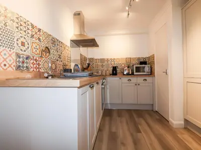 a kitchen with a sink and a microwave at EdyVean in St Austell
