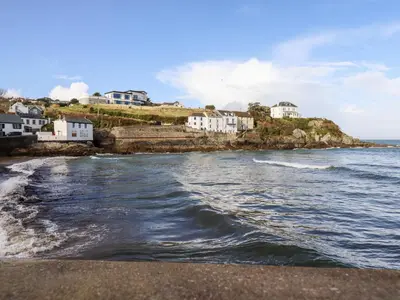 a view of a beach with houses and the ocean at EdyVean in St Austell