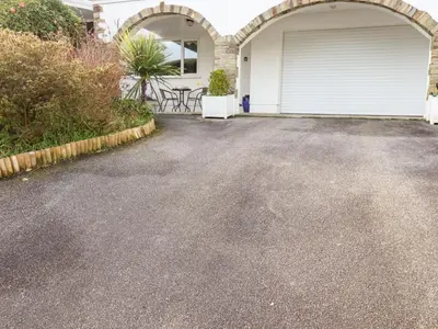 a driveway in front of a house with a garage at EdyVean in St Austell