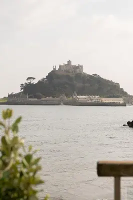 a castle on top of an island in the water at The Godolphin Hotel in Marazion