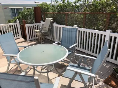 a table and chairs sitting on a patio at Bluebird K16 in St Merryn