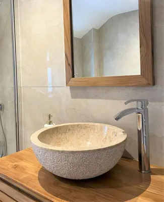 a bathroom sink with a large stone sink at The Little Seahorse - Newly Renovated Cottage 5mins Walk The Beach with Hot Tub in Tywardreath