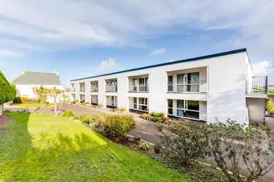an exterior view of a white building at Westward 8 in Polzeath