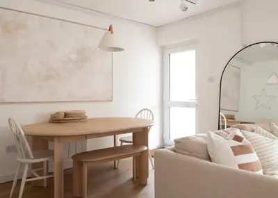 a living room with a table and a couch at Westward 8 in Polzeath