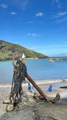 a statue of a man standing on a beach at Lobster Cove, Excellent location, Close to beach & coastal walks, Family run in Port Isaac